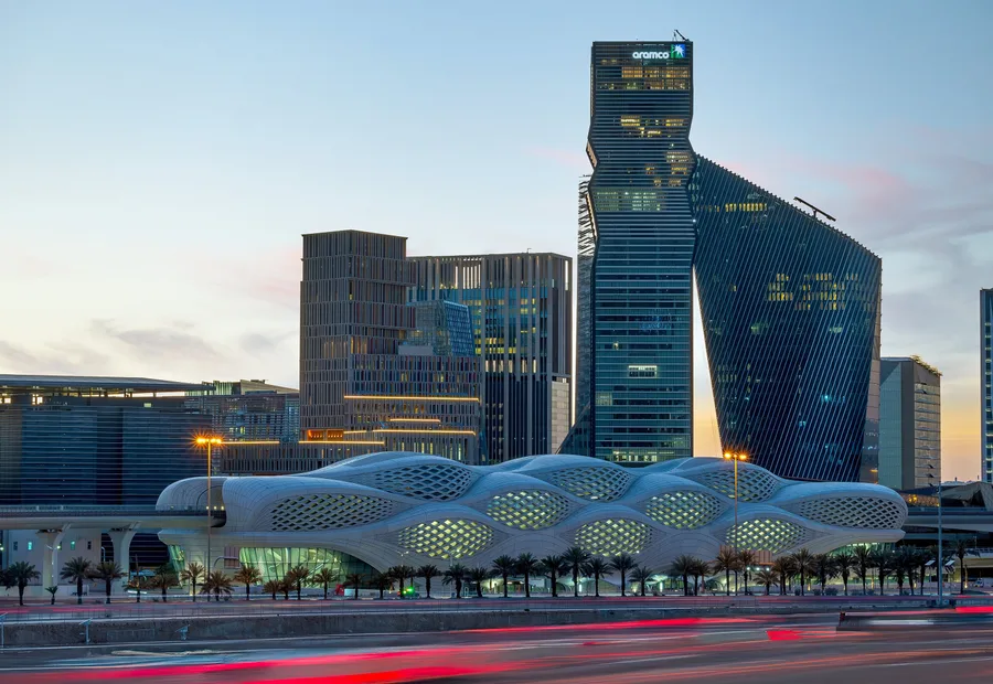Metro station and towers in the King Abdullah Financial District at dusk