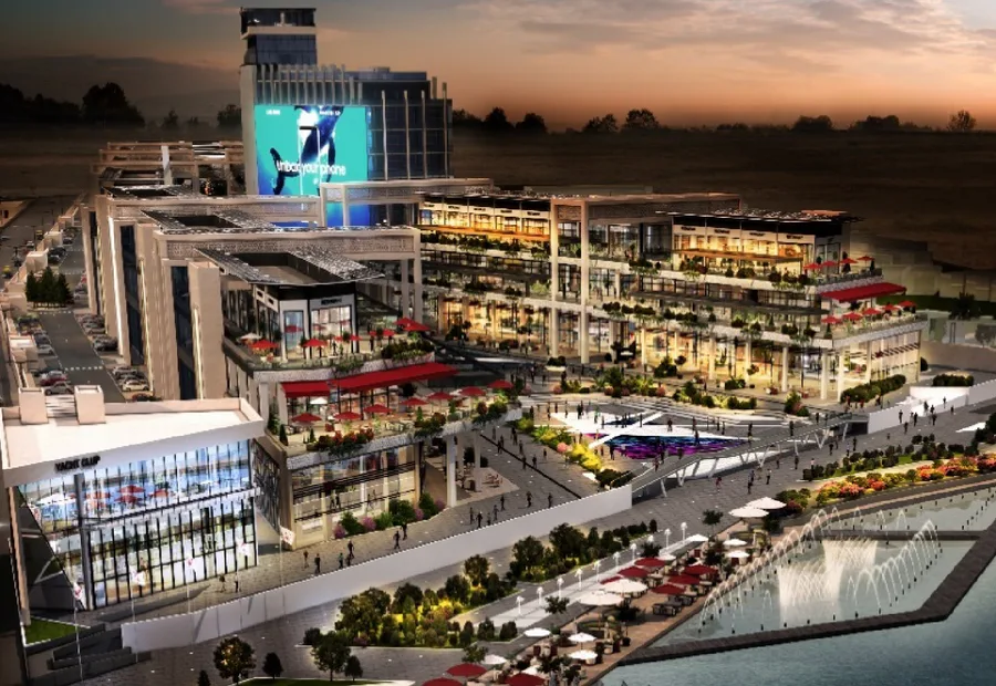 Waterfront mixed-use development rendered at dusk